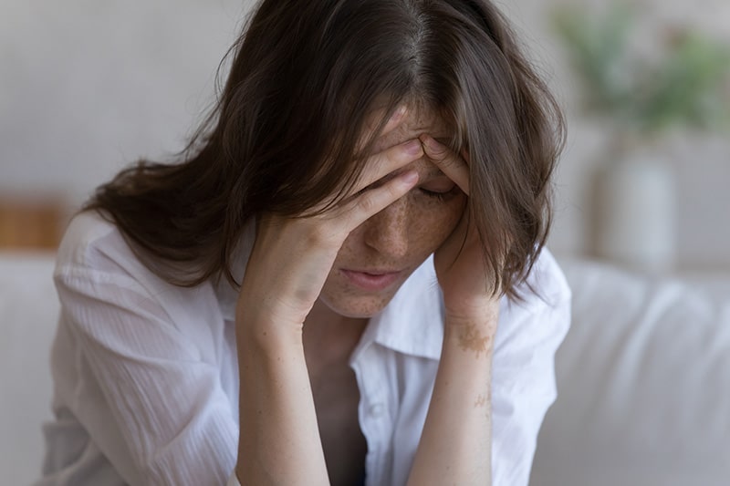 A woman shows signs of depression.