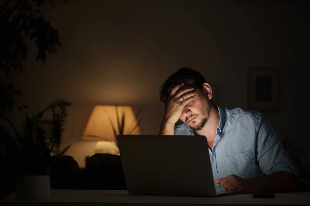 A man struggles with technology addiction.